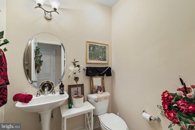 bathroom with sink and toilet