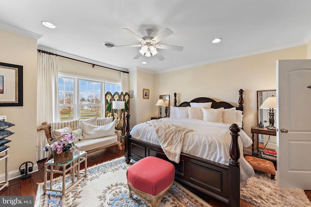 bedroom featuring dark hardwood / wood-style flooring, crown molding, and ceiling fan