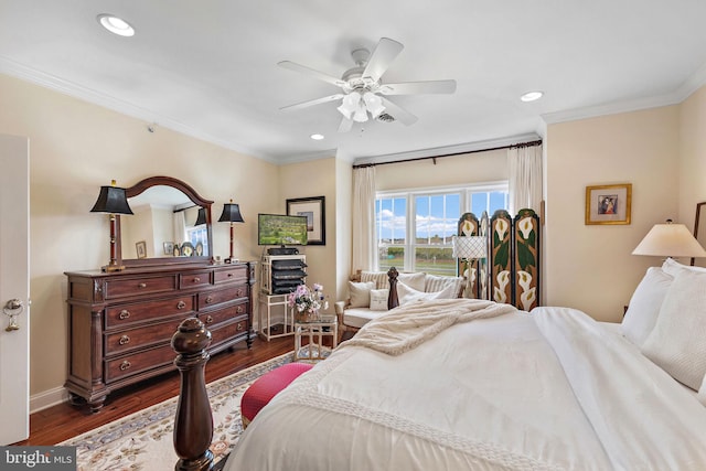 bedroom featuring ceiling fan, ornamental molding, and dark hardwood / wood-style floors