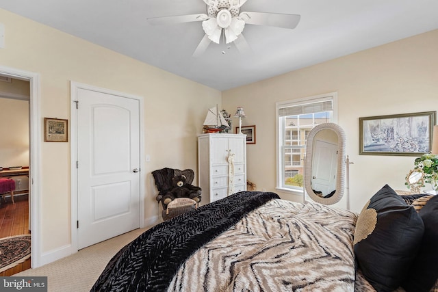 bedroom featuring ceiling fan and light colored carpet