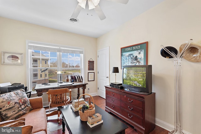 living room featuring dark hardwood / wood-style floors and ceiling fan