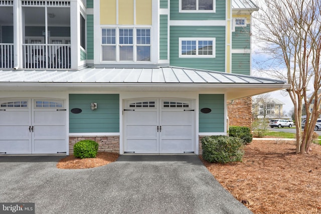 multi unit property featuring a garage