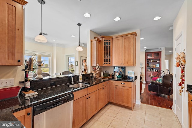 kitchen featuring decorative light fixtures, light tile flooring, sink, and stainless steel dishwasher