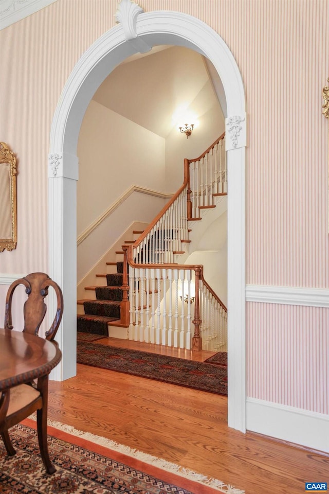 stairs featuring hardwood / wood-style flooring