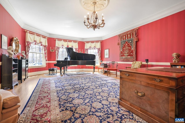 living room with a notable chandelier, ornamental molding, and light hardwood / wood-style floors