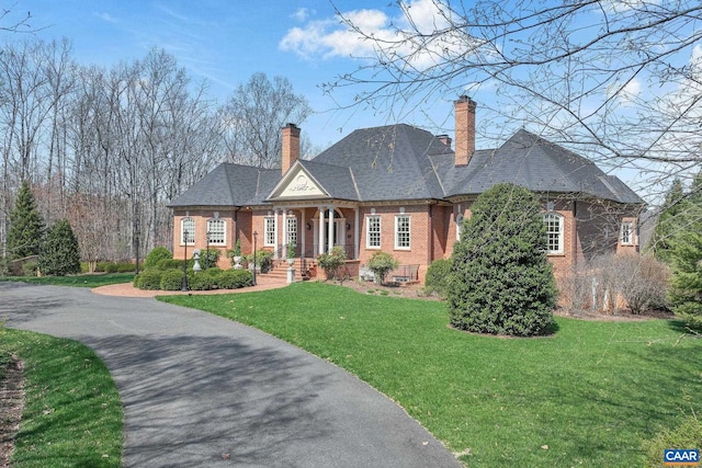 view of front of home with a front yard and covered porch