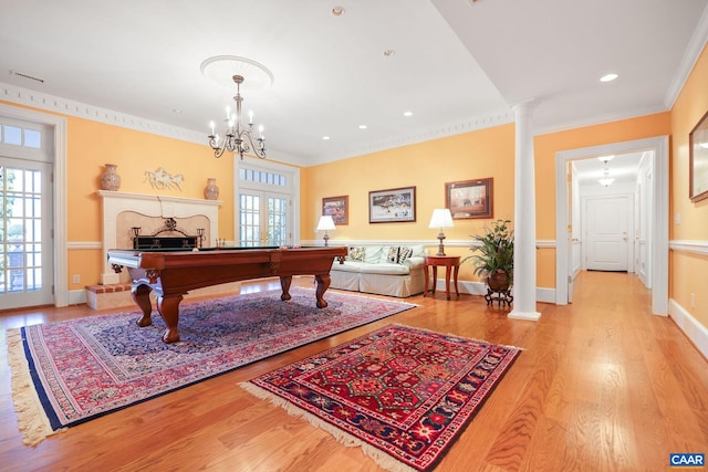 recreation room with french doors, ornamental molding, a chandelier, light hardwood / wood-style flooring, and pool table