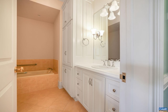 bathroom with vanity, tile flooring, and tiled bath