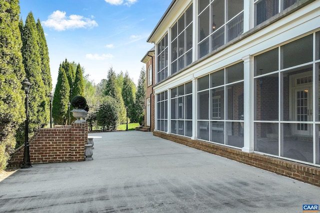 view of terrace with a sunroom