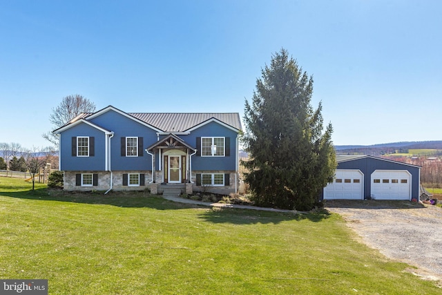 split foyer home featuring a front lawn and a garage