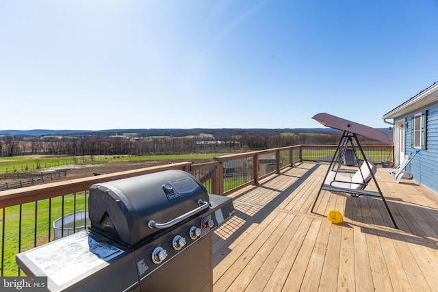 deck with a lawn and a grill