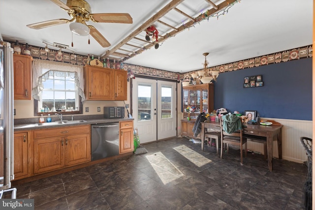 kitchen with ceiling fan, a healthy amount of sunlight, sink, and stainless steel dishwasher