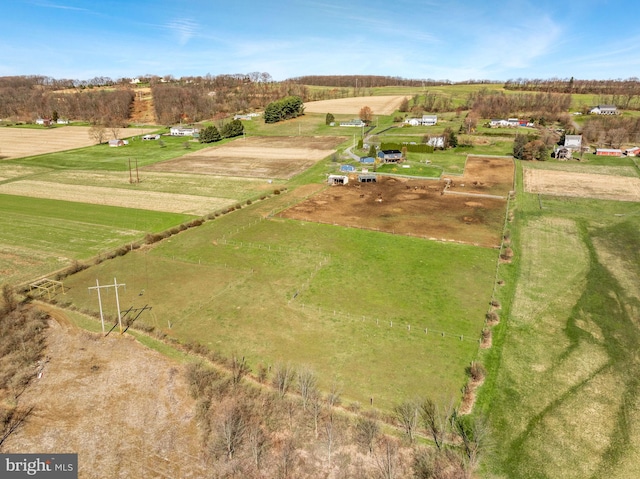 birds eye view of property with a rural view