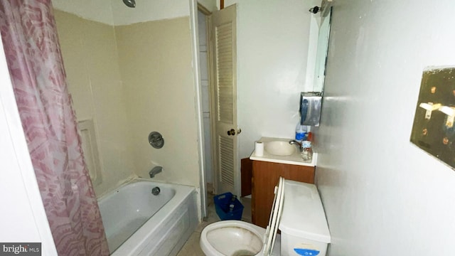 full bathroom with vanity, shower / bath combo, and toilet