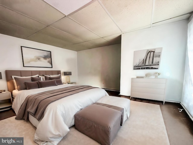 bedroom featuring a paneled ceiling