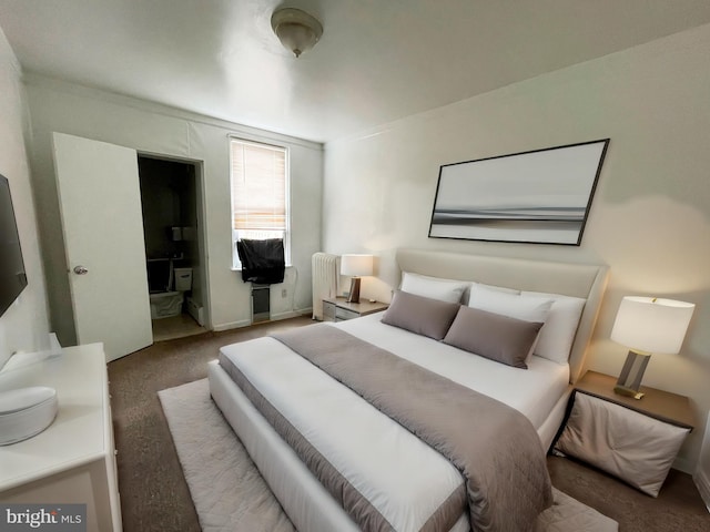 bedroom featuring carpet floors, connected bathroom, and radiator heating unit