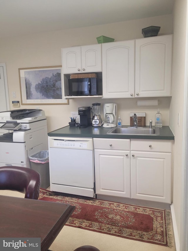 kitchen featuring white cabinetry, sink, and white dishwasher