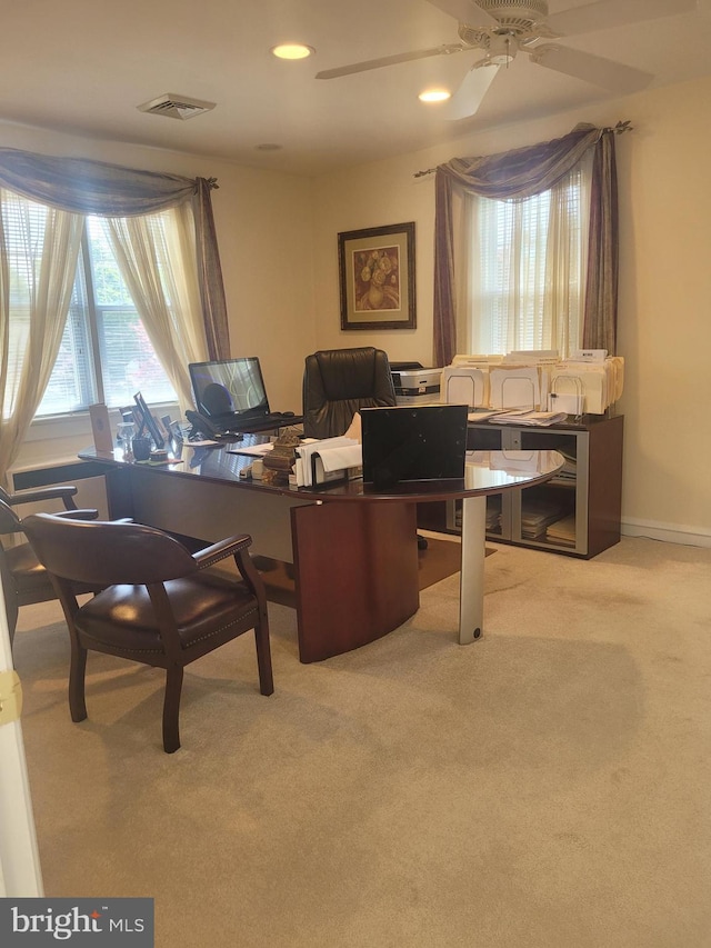 office area featuring light colored carpet and ceiling fan