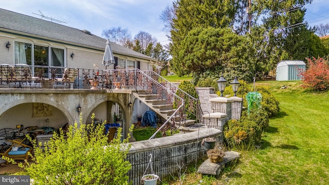 exterior space with a patio, a shed, and a yard