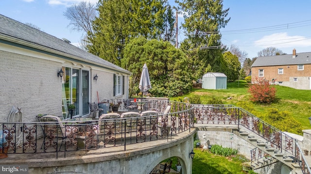 view of yard with a patio and a storage shed