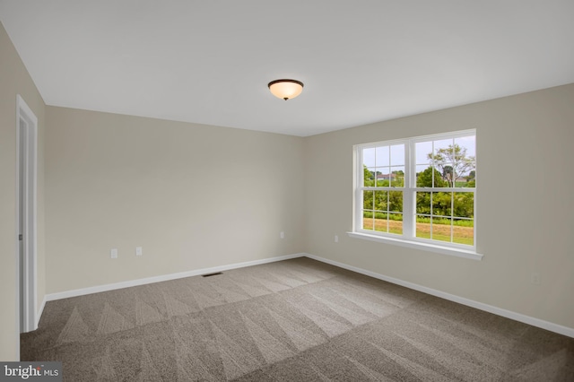 unfurnished room with carpet floors