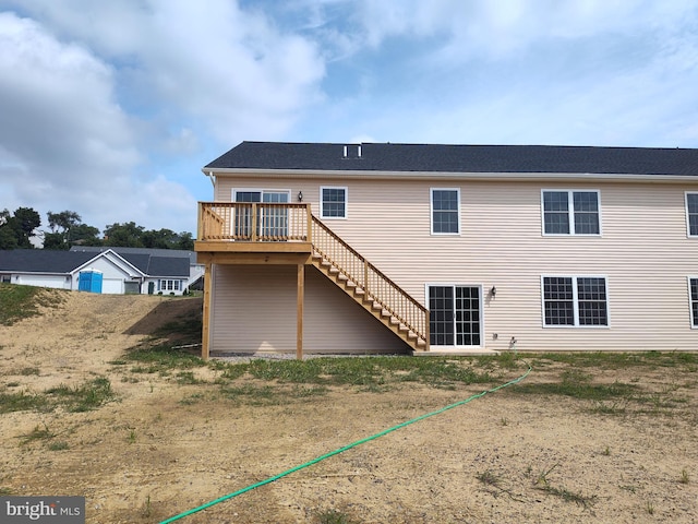 rear view of house with a deck