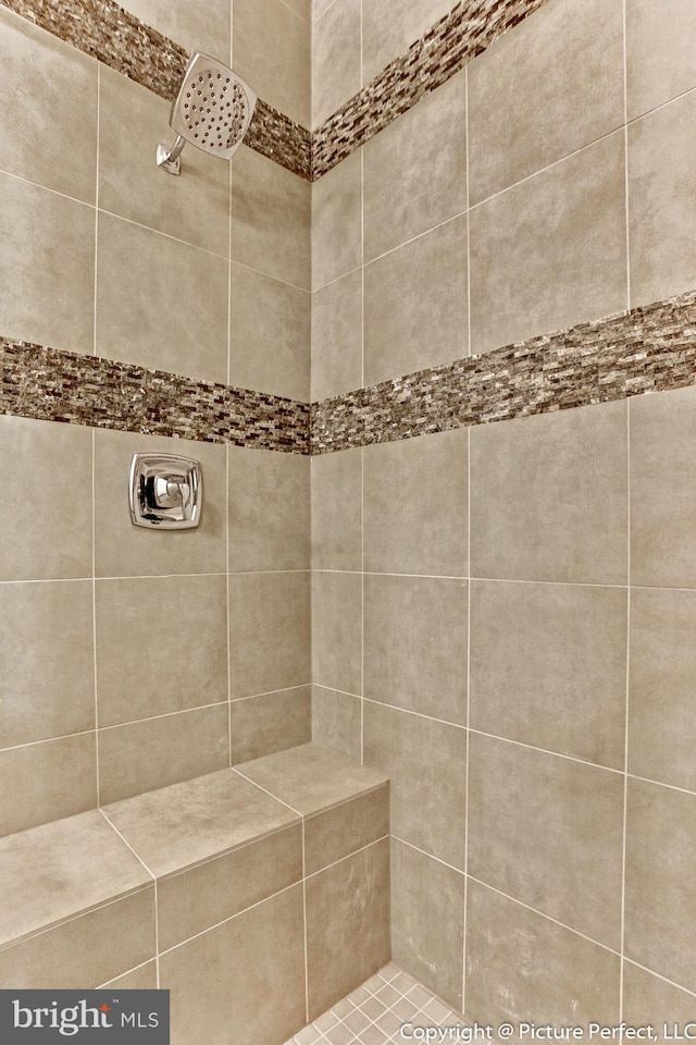 bathroom with tiled shower