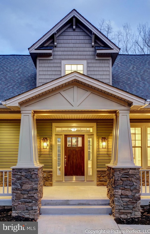 property entrance featuring covered porch