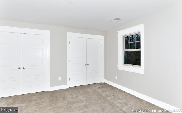 unfurnished bedroom with carpet