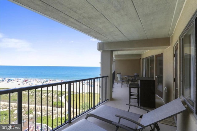 balcony featuring a water view