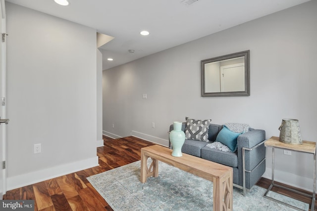 living room featuring dark wood-type flooring