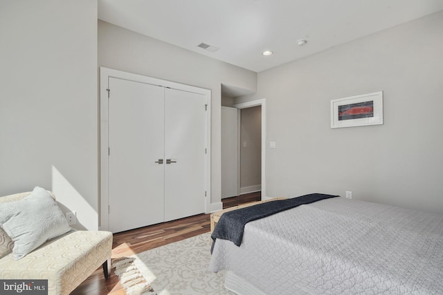 bedroom featuring a closet and wood-type flooring