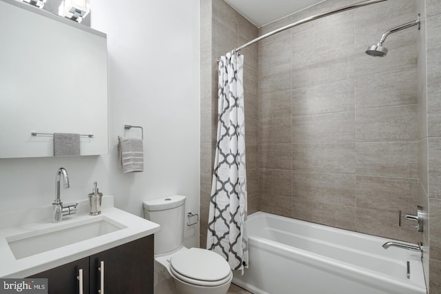 full bathroom featuring toilet, vanity, and shower / bath combo with shower curtain