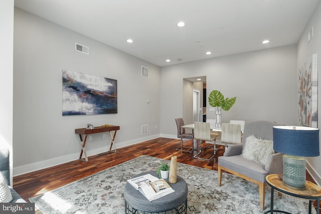 living room featuring dark wood-type flooring