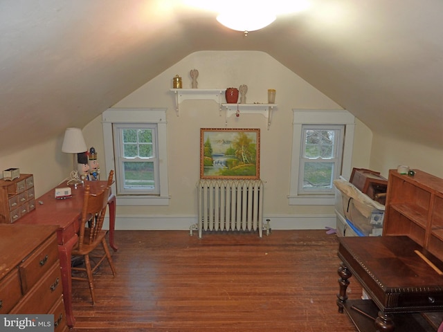 home office with lofted ceiling, dark wood-type flooring, and radiator