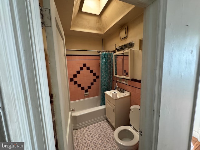 full bathroom featuring toilet, shower / bath combo, tile floors, and large vanity