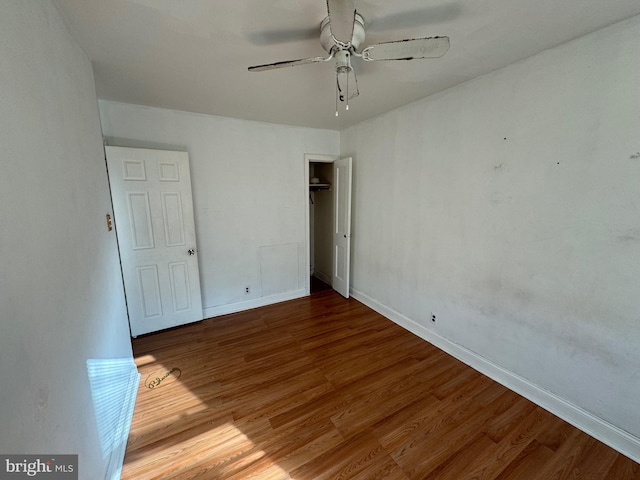 unfurnished room featuring ceiling fan and hardwood / wood-style floors