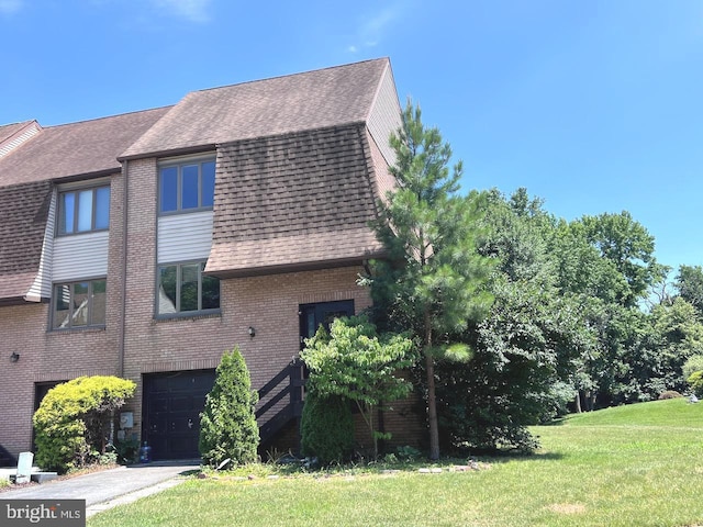 view of property exterior with a garage and a lawn