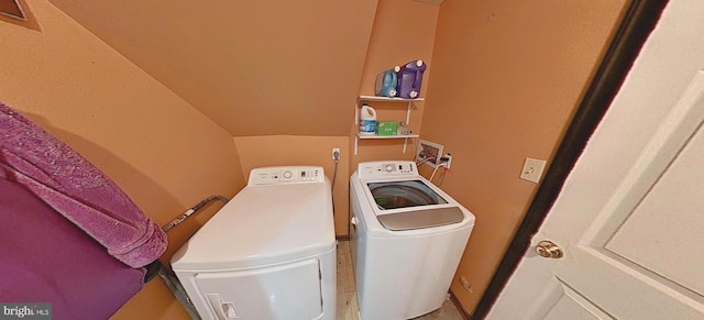 laundry area with washing machine and clothes dryer