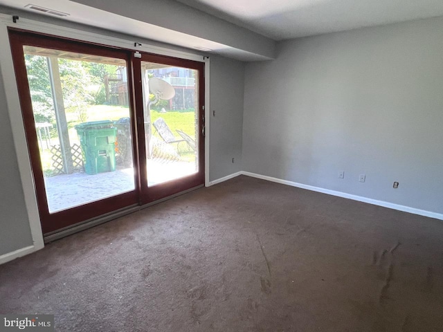 empty room with carpet flooring