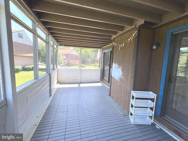 unfurnished sunroom with a healthy amount of sunlight