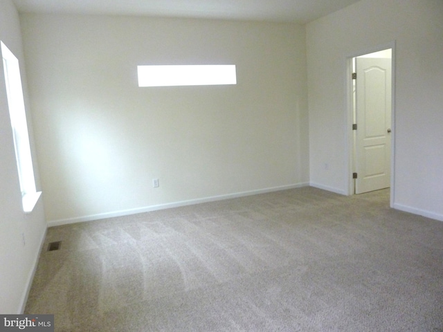 spare room with light colored carpet