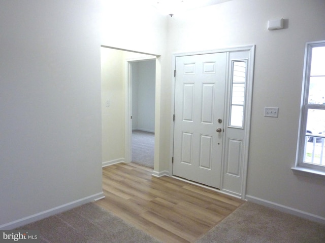 entryway with light hardwood / wood-style floors