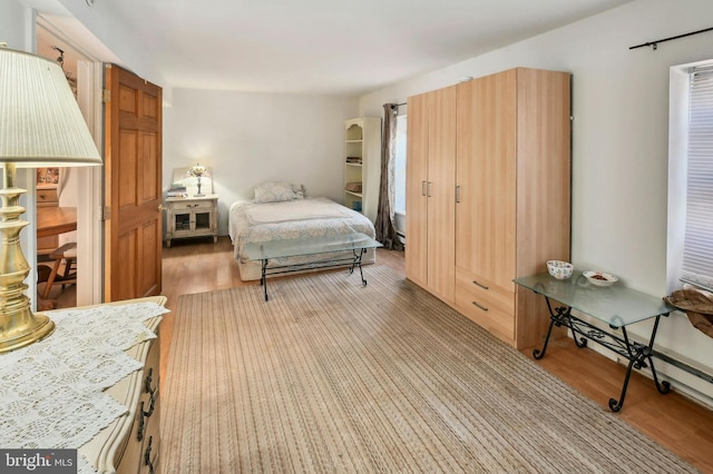 bedroom with light hardwood / wood-style flooring