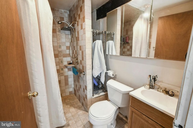 bathroom with a shower with shower curtain, large vanity, tile floors, and toilet