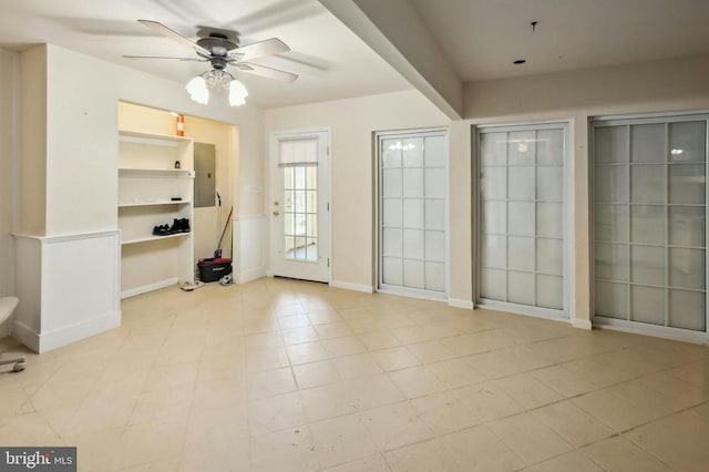 entryway with ceiling fan and light tile flooring