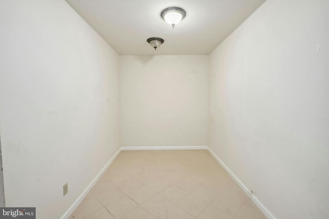 spare room with light tile floors