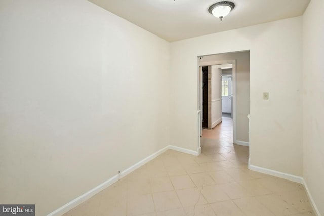 empty room with light tile floors