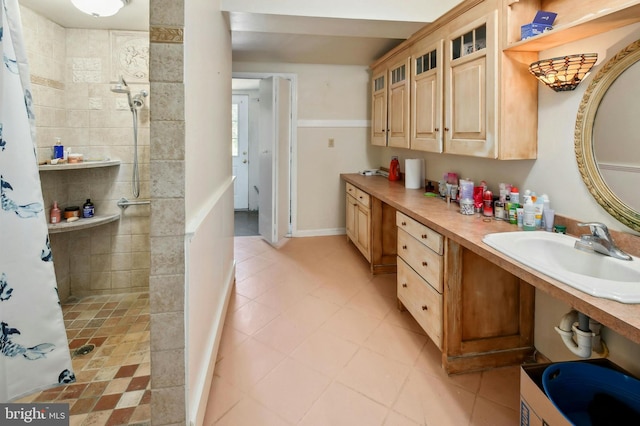 bathroom featuring tile flooring and vanity