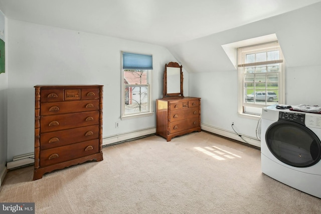 laundry room with light colored carpet, a baseboard radiator, and washer / dryer